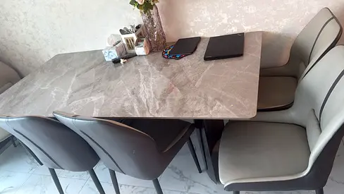 Modern grey marble-effect dining table with 6 upholstered chairs