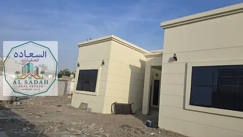 Two adjacent houses for sale in Al-Talaa, each with its own electricity meter. The first house has