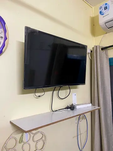 32-inch LED TV wall-mounted in good working condition