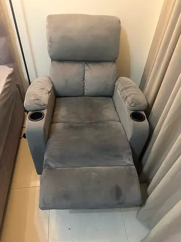 Single grey microfiber recliner armchair with cup holders