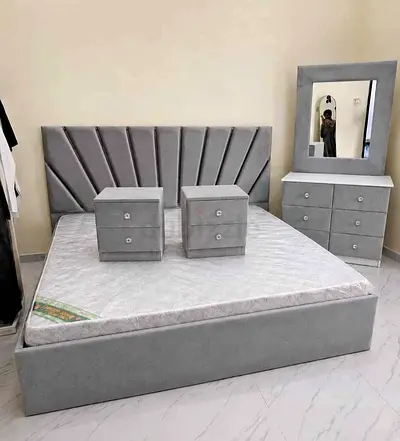 Grey upholstered king bed with mattress, 2 bedside drawers and dresser with mirror