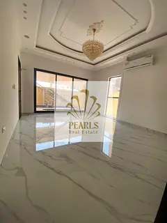 Luxury villa for annual rent in Al Yasmeen, Ajman, with a swimming pool and spacious outdoor area. E