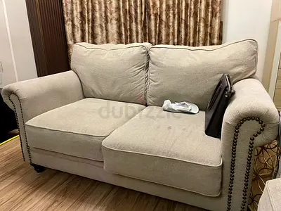 Beige 2-Seater Sofa with Nailhead Trim — Good Condition