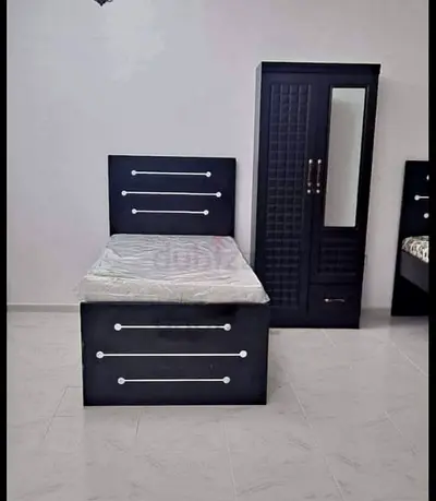 Brand new Single bed with mattress and matching wardrobe - dark wood set