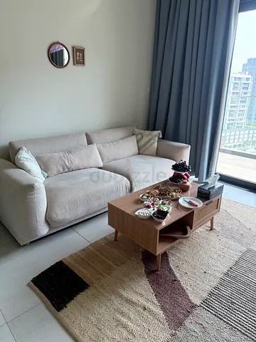 Beige 4-seater comfortable sofa in good condition
