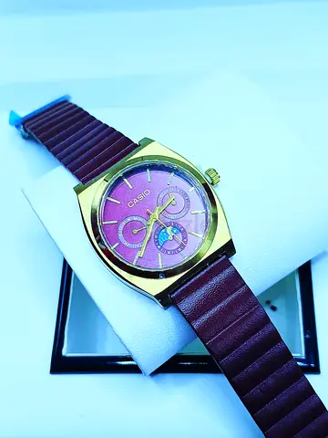 Casio women's gold-tone watch with burgundy strap, working condition
