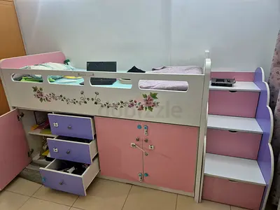 Pink and white loft bunk bed with storage drawers and shelves