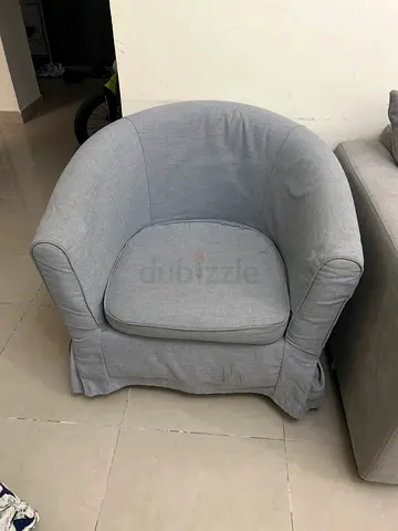 Light grey fabric armchair in good used condition