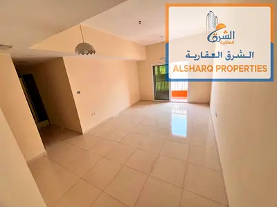 Two-bedroom apartment with a living room for annual rent in Al Muwaihat 3 - Ajman, with a very large area and a prime location.