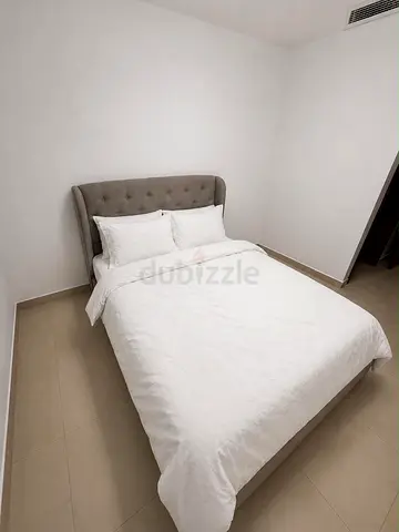 Queen-size grey ottoman bed in excellent condition