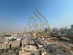 ✨ Spacious two-bedroom apartment for annual rent in Al Majaz 2, Sharjah, featuring a balcony, buil