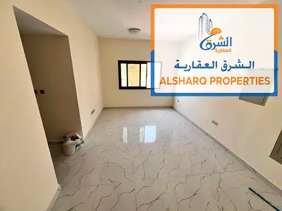 One bedroom and living room, second occupant, in a new building in Al Nuaimiya 2, with a large area, central air conditioning, and maintenance include