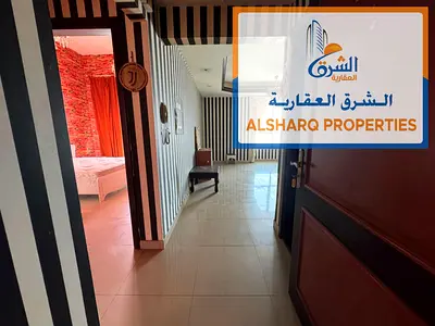 Balcony with open city views – Gym, swimming pool, and free parking – Master bedroom – Prime location on Ajman Corniche, close to all amenities
