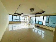 Luxury 2BR + hall with sea view in Corniche Towers, balcony, 3 baths, free AC, gym, pool & parking.