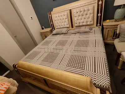 King size ornate wooden bed with mattress and 2 side tables. Dressing table and stool