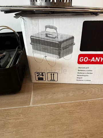 Weber Portable charcoal BBQ grill with lid (used) includes starter basket, instructions and box.