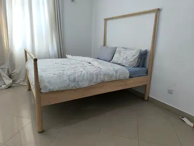 Light wooden king size bed frame with headboard and footboard