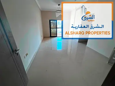 Two-bedroom apartment with a living room, first occupancy, in Al Rashidiya 1, with high-end finishes and a balcony.