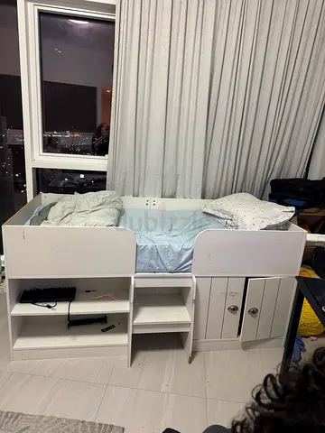 White single bed with built-in shelves and drawers - good condition