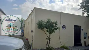 House for sale in Nasiriyah, three sections: Section 1 has 3 rooms, a living room, and a kitchen; Se