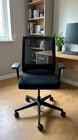 Black Steel Case ergonomic office chair with mesh back and adjustable arms