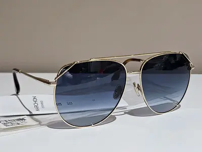 Gold frame aviator sunglasses with blue gradient lenses
