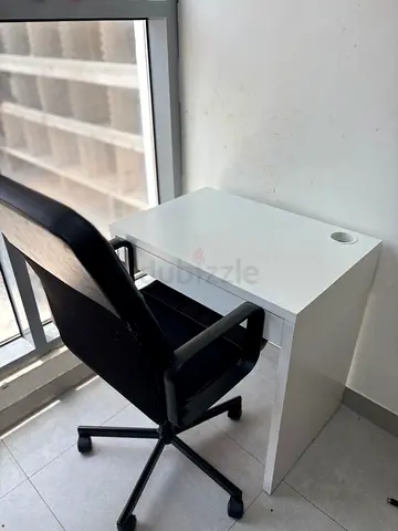 Ikea white study desk with cable hole - compact workspace with desk chair