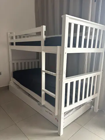 Bunk bed with mattresses and trundle bed