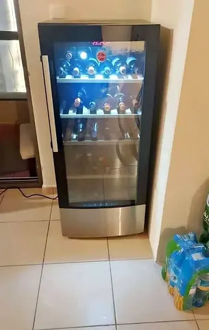 Upright glass-door wine cooler/fridge – holds multiple bottles, working condition