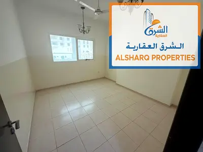Two bedrooms, a living room, and two bathrooms, next to Day Today in Al Jurf Industrial Area. Spacious area.