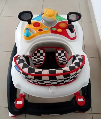 Baby walker with activity tray and cushioned seat - good condition