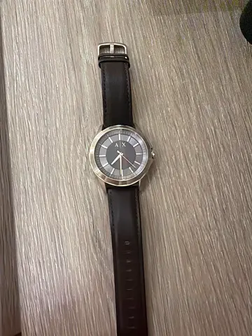 Men's classic analog wristwatch with black leather strap
