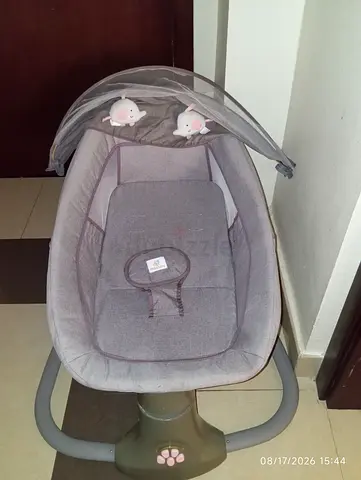 Gently used grey baby rocker/bouncer with toy arch