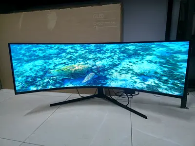 The Samsung Odyssey G9 QLED is a massive 49-inch super ultra-wide curved gaming monitor. Featuring