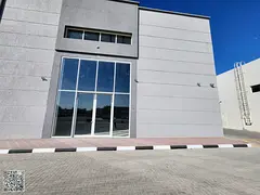 A commercial complex consisting of shops and multiple warehouses, with a large area suitable for all