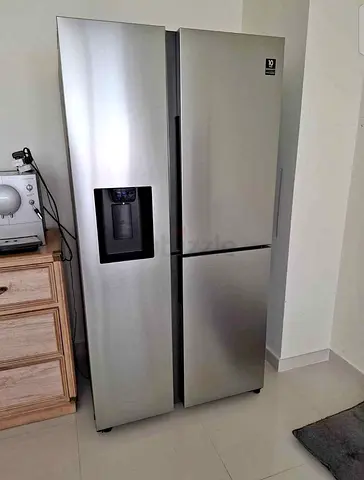 Stainless Steel Side-by-Side Refrigerator with Water Dispenser – Good Condition