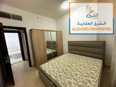 Two-bedroom apartment with a living room for annual rent in City Towers - Al Nuaimiya, with a large area and a vibrant location.