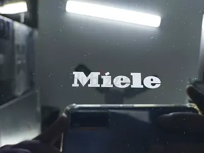Miele New Model DAH 4970 Sienna in Obsidian Black is an angled wall-mounted cooker hood..90Cm