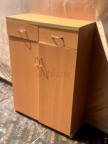 Compact wooden cabinet with two doors and drawer - lightly used