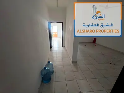 **Annual Rent - 2 Bedrooms and Living Room | Second Row from Ajman Corniche**  A distinctive apartment in a prime location on the **second row from Aj