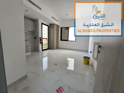 High-end Ajman apartment with a balcony offering excellent views. First occupancy. Central air conditioning. Wardrobes. Located on the Dubai exit.