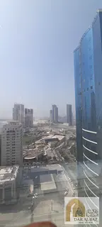 Two-bedroom apartment for annual rent in Al Taawun, Sharjah | Partial sea view | On the main street 