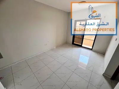 Master bedroom with balcony and built-in wardrobes in Rawda 1, directly on the main road, near Sheikh Ammar Street and opposite Kenz Hypermarket.
