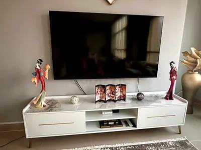 Sony TV 65 inches and Modern white TV unit with marble top and storage drawers