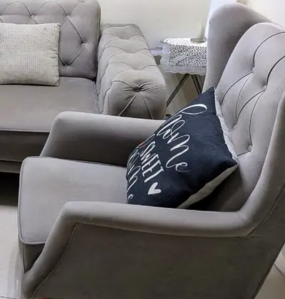 2x Grey tufted armchair in excellent condition