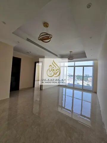 Spacious unit in Al Rawda 1 featuring two bedrooms (including a master bedroom with a balcony and built-in wardrobes), a living room, two bathrooms, a