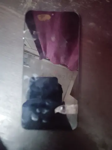Used black smartphone with cracked screen