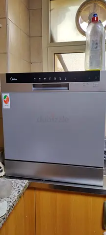 Compact countertop/portable dishwasher in good working condition with 20 pkt of dishwashing material