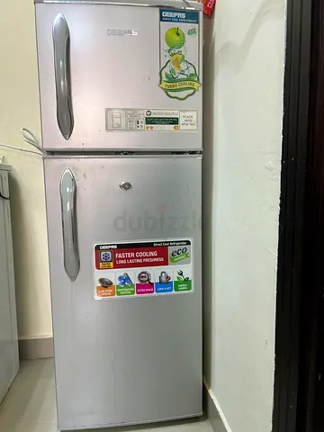 Silver double-door refrigerator - good working condition