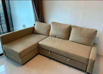 L-shaped beige fabric sofa with storage - good condition